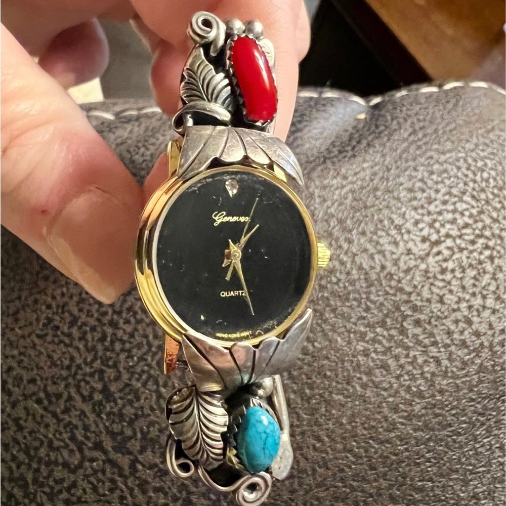 Navajo jewelry. This is a very unique turquoise and coral ring with a watch